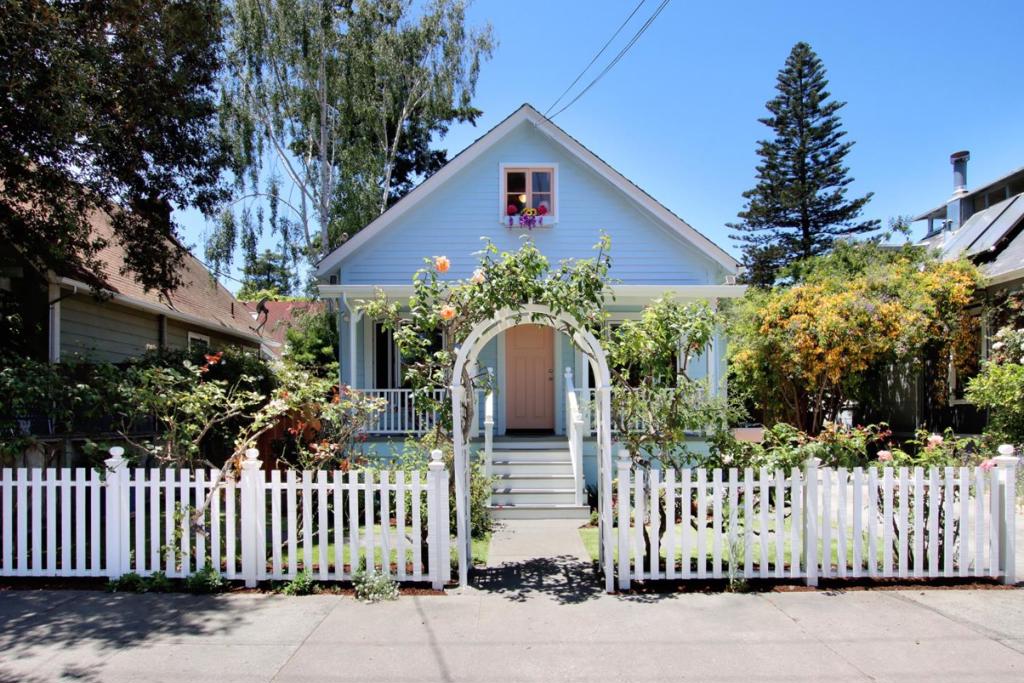 From the moment you walk under the rose arch it just gets better! To have this much charm and be in this great shape, is hard to find. High ceilings, sash windows, & wood floors. Downstairs boasts a bedroom and remodeled bathroom, & sweet office. Great open dining room/living room combo next to the kitchen. A garden window in the freshly updated kitchen looks out to the oasis of the yard. The variety of trees & flowers and total privacy creates a secret paradise, but is so close to town. The upgrades start in the bathroom and kitchen and go down to the bones. Enjoy morning coffee or tea in the serene and private backyard sanctuary, where you will find a delightful assortment of mature trees and flowers including maple trees, birch trees, ginger, roses lavender, hydrangaes, and so much more! Luxurious garden that boasts a variety of abundant blooms in every season. The mature trees provide a shaded haven for outdoor gatherings. Upstairs you will find skylights in the master bedroom, a second bedroom, an office room, a full bathroom, and a separate entrance, this space offers a myriad of possibilities. So close its an easy walk to downtown favorites, shops, restaurants, and entertainment. This house offers the best of both worlds.