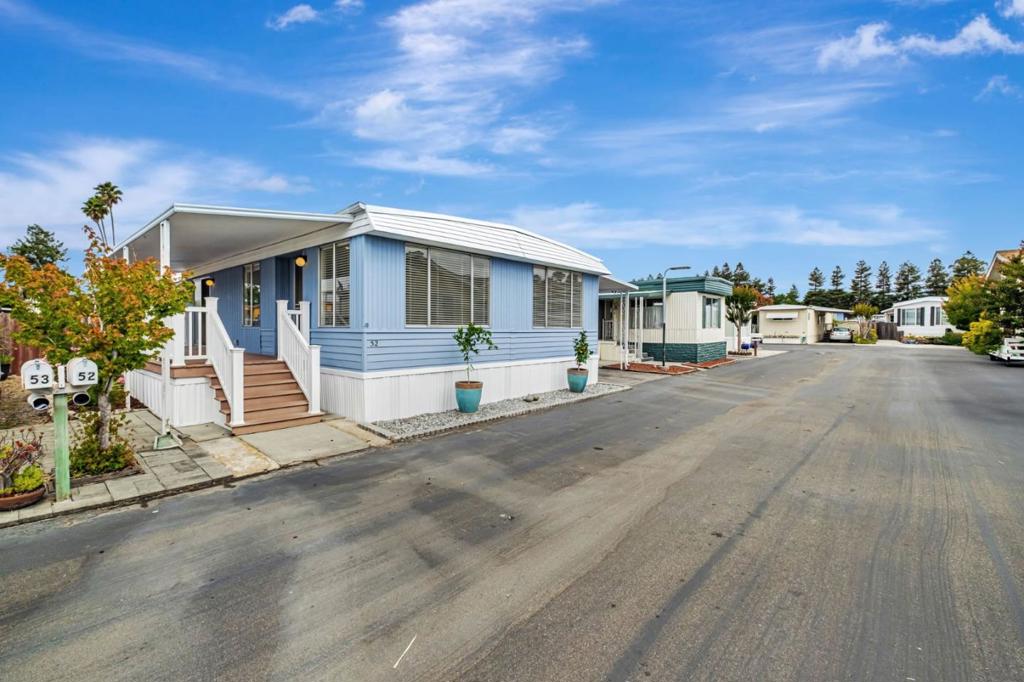 Welcome to this inviting 2-bedroom, 2-bathroom mobile home nestled in the vibrant heart of Capitola. Boasting a generous 1,244 square feet of living space, this home offers both comfort and potential. Step onto the oversized front porch perfect for entertaining family and friends and enter through sliding glass doors into a bright and open dining area and kitchen. The thoughtful layout features two spacious bedrooms, including a primary suite complete with a large en-suite bathroom, walk-in closet, and private access to the backyard. Outside, you'll find a private backyard space waiting for your personal touch. Whether you're dreaming of a garden retreat, outdoor dining area, or a relaxing oasis, the possibilities are endless. Located just minutes from Capitola Village, beaches, shopping, and dining, this home offers the perfect blend of convenience and coastal charm. Don't miss your opportunity to own this hidden gem!