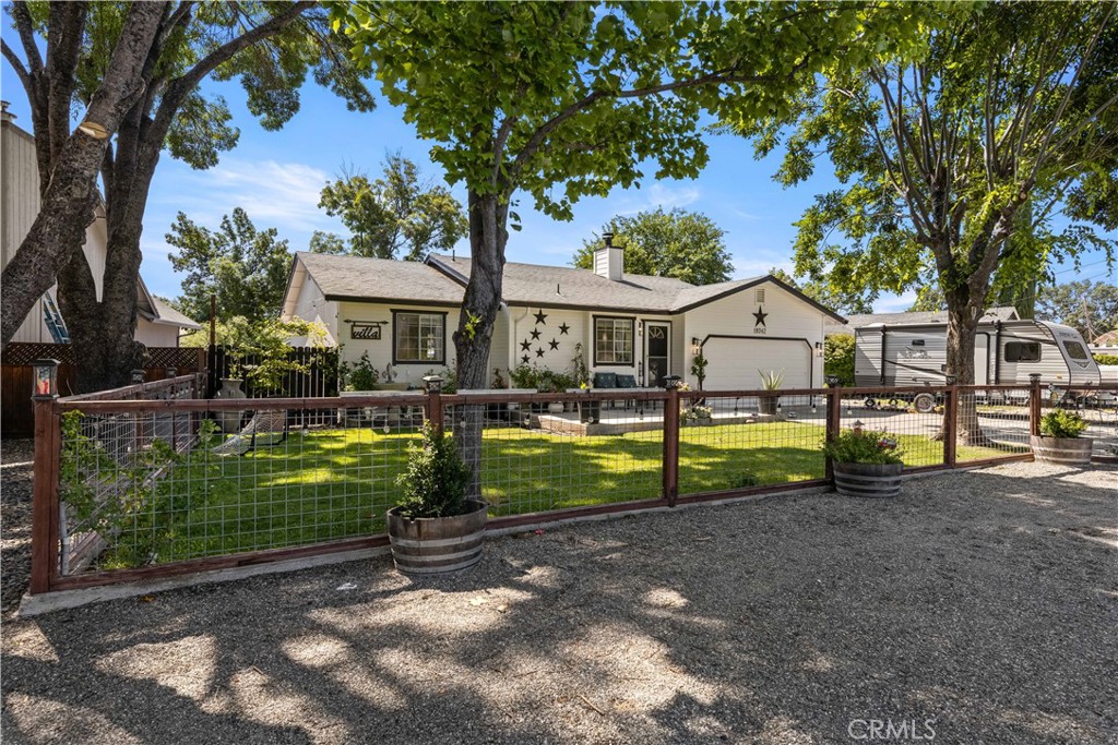 Welcome to the stunning Hidden Valley community, where serenity meets charm in this exceptional 3-bedroom, 2-bathroom home—a true gem that exemplifies modern living with a touch of nature's beauty. As you step into this meticulously maintained residence, you’ll immediately be captivated by its unique features that blend comfort, style, and functionality. Recently upgraded amenities include a new flooring, modern vanities in the bathrooms, a new dishwasher, stove, disposal, and stylish ceiling fans throughout the home. New paint outside and in as well. These thoughtful updates provide a perfect blend of contemporary luxury and everyday ease. With beautiful landscaping and a comprehensive irrigation system, the outdoor space is picturesque . Enjoy your evening refreshment on the front deck while watching the mesmerizing sunsets and the local wildlife visiting the pond The fully fenced backyard boasts a separate garden area with tool shed that are ready for your green thumb to cultivate! Living in a gated community offers an exclusive lifestyle with access to a pristine private pool and a picturesque lake and golf. Experience the charm this beautiful region has to offer. wineries, fishing, outdoor activities, so much more. This remarkable property is not just a home; it’s a lifestyle