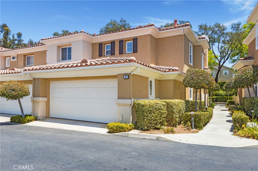 Experience the Height of Luxury Living in the Heart of Rancho Santa Margarita! Welcome to this exceptional 3-bedroom, 3-bathroom end-unit townhome, perfectly situated in the highly sought-after Terracina community. Tucked into one of the most peaceful and private locations, with only one shared wall and no rear neighbors, this meticulously maintained home offers the ultimate in comfort, privacy, and convenience. Step inside to soaring ceilings and an abundance of natural light, beautifully enhanced by plantation shutters and a cozy gas fireplace. The expansive dining area flows seamlessly into a stylish kitchen featuring granite countertops, stainless steel appliances, and a refrigerator that stays with the home. Updated lighting adds a modern touch throughout. Just off the living room, sliding glass doors lead to a serene private patio, an entertainer’s dream. Enjoy flagstone flooring, a built-in gas firepit, tranquil water feature, and a flourishing lemon tree, all in a quiet single-loaded setting with unmatched privacy.
The main floor offers a spacious bedroom with an oversized closet, ideal for guests or a home office, alongside a fully updated 3/4 bathroom with a walk-in shower and pedestal sink. Additional features include a coat closet, direct access to a 2-car garage with epoxy flooring, built-in storage, and a 240V outlet ready for your EV charger. Upstairs, the primary suite impresses with dual closets, a ceiling fan, and a beautifully appointed en-suite bathroom complete with granite counters, dual sinks, and custom medicine cabinets. A third bedroom enjoys ample natural light and easy access to a full bath with a tub/shower combo. The dedicated laundry area includes a full-size washer and dryer for added convenience. As a resident of Terracina, you’ll enjoy exclusive access to the community pool and spa, along with full SAMLARC membership offering amenities like the RSM Beach Club Lagoon, hiking trails, Olympic-size pools, parks, and year-round events. Ideally located just a short stroll to RSM Lake, Central Park, shopping (including Target and Trader Joe’s), dining, and Cinepolis movie theater, this is Southern California living at its best.
Don’t miss your chance to call this rare gem in Terracina home—luxury, lifestyle, and location all in one.