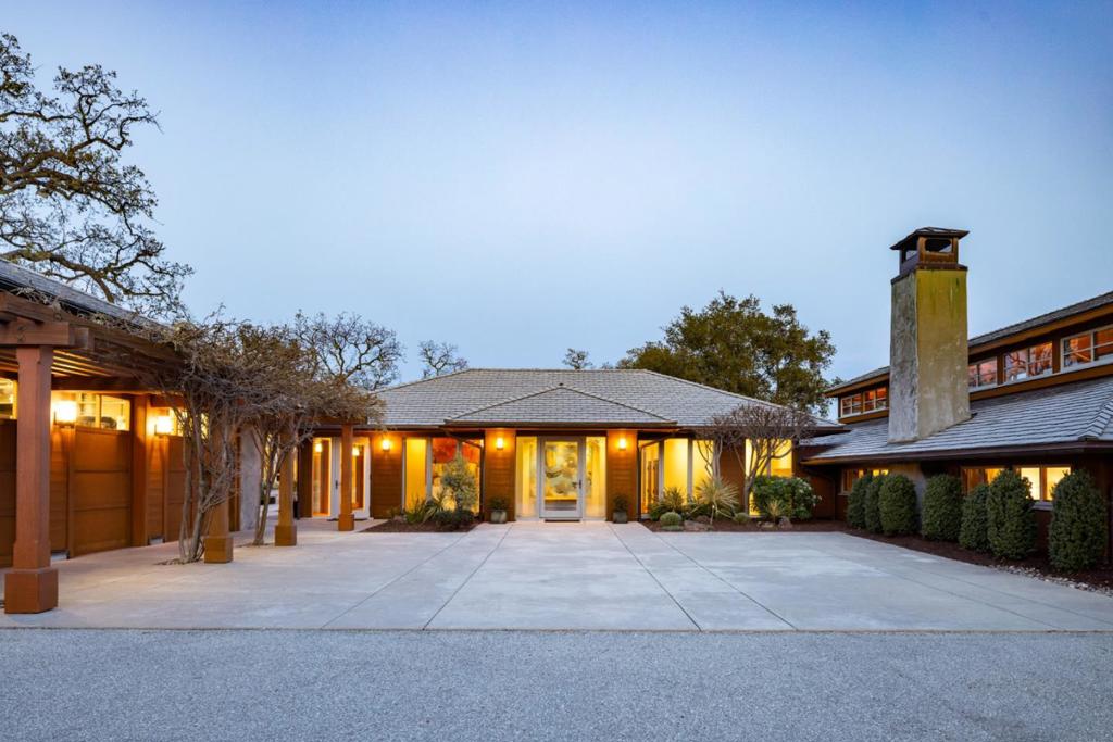 Privately situated in the 20,000 acre Santa Lucia Preserve, just minutes from the award-winning Preserve Golf Club, rests this Hart-Howerton custom designed estate on over 45 majestic acres. Behind secured gates, enjoy unobstructed sweeping views of the Santa Lucia Mountains, painted with redwoods & oaks, with the convenience of world class amenities at your fingertips. The 3 bed, 2.5 bath main house, and the 2 bed & 2 bath with living room and kitchen guest house, additional studio plus bonus space with a gym and wine storage offer diverse living areas with ample outdoor entertaining spaces. The single level contemporary craftsman style uses earth tones and materials including the slate roof, corten & wood siding, floor to ceiling mahogany windows and doors and concrete floors with radiant heat and air conditioning. The well-equipped chefs kitchen with Sub Zero refrigerator and Wolf range is well positioned and convenient to the outdoor BBQ, kitchen, & fireplace with spectacular views. This property also allows for an addition of a barn, pool and is equestrian approved. Enjoy your privacy in nature in this tranquil setting with resident services, hiking trails, equestrian center, pickle ball courts, pools, fitness center & exquisite cuisine at the Preserve Ranch and Golf Clubs.