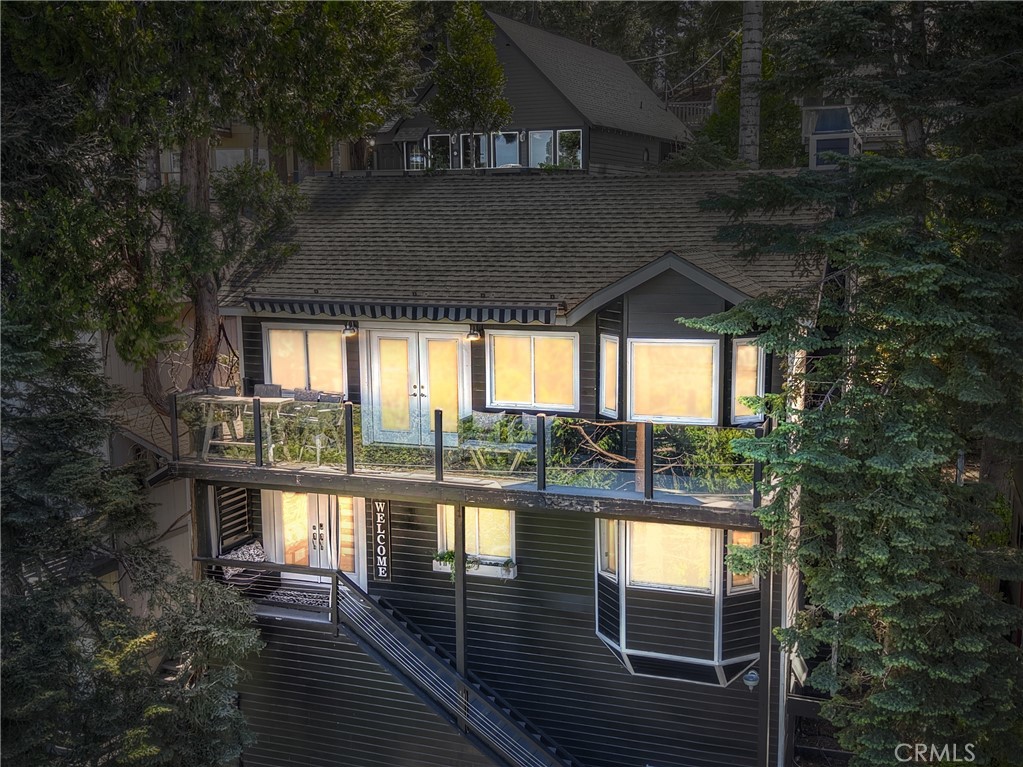 Discover your dream getaway with this stunning, fully remodeled lake-view cabin in Lake Arrowhead! This turn-key opportunity is beautifully furnished and decorated, offering a seamless move-in experience. Spanning 2,145 sq. ft., the home features 3 bedrooms ( all en-suite) and 3.5 bathrooms—perfect for family retreats or investment.Enjoy breathtaking lake vistas from every window, with central heating and newer dual-pane windows ensuring comfort year-round. The incredible mountain-modern kitchen and bathrooms are appointed with designer fixtures and finishes, making every detail impeccable. Inside laundry adds convenience to this professionally decorated, immaculate home.Perfectly suited as a successful short-term rental, with plowed roads for easy access year-round. Located on a culdesac for barely any traffic, with public utilities and high speed internet. The area of this property is heavily forested and surrounded with Dogwoods to make Spring & Fall just wonderful! HOA "does" allow STR and this has been a successful one indeed! HOA includes road plowing, water & trash. Location is unbeatable—just 5 minutes from Hwy 18 and equally close to Arrowhead Village for shopping and dining. Don’t miss your chance to own this exceptional mountain retreat—living the lake life has never been easier!