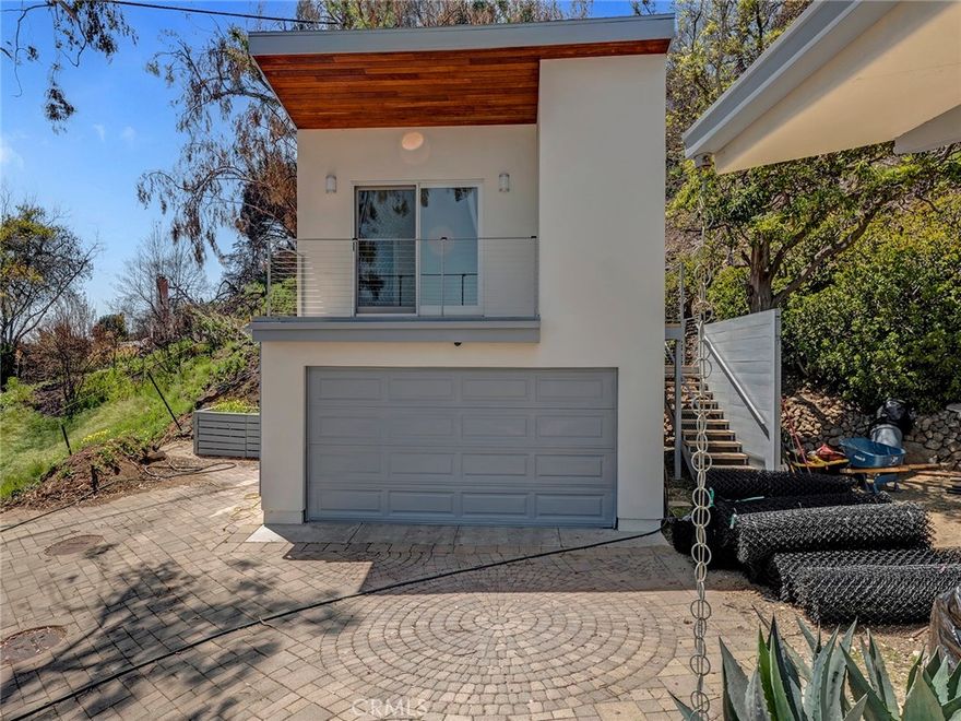 Remodeled Guest Unit with bath, kitchen. washer/dryer and walk-in closet above the detached 2-car garage offers a large balcony with amazing ocean views. With mature landscaping, a generous play area, and a Tesla charger already installed, this home combines timeless design with modern convenience. Just minutes from Pacific Coast Highway and a short distance from Santa Monica, this is more than a home—it’s an invitation to live the Malibu dream. Main house is only used by the Home-Owner during the weekends. Student and Pet friendly!