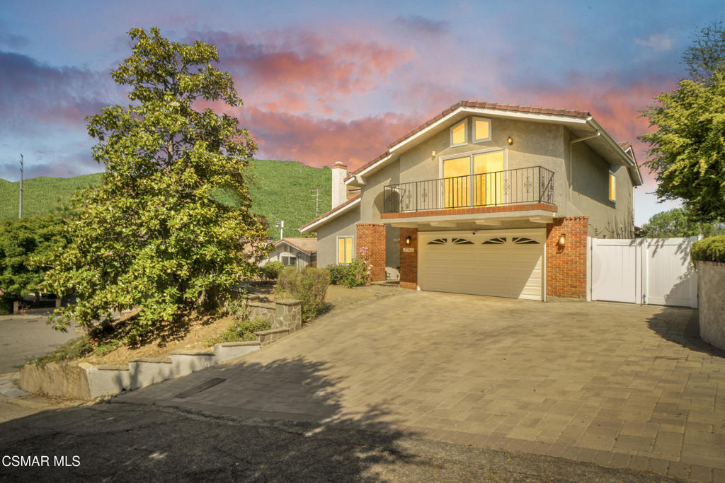 Welcome to this beautifully updated 4-bedroom, 3-bathroom home nestled in a great pocket of Agoura Hills. With fresh interior paint, rich hardwood flooring throughout, and an updated kitchen, this move-in-ready gem awaits you!The main level features a sprawling layout starting with a formal living room with a cozy fireplace, high ceilings, and a spacious dining area, leading you to the updated kitchen that opens seamlessly to the huge family room that shows off some great views of the backyard. Downstairs also includes a beautifully remodeled bathroom with a walk-in shower.Upstairs, you will love the spacious primary suite that boasts vaulted ceilings, a marble fireplace, and a private balcony with stunning mountain views. The secondary bedrooms are generously sized with ample closet space and a beautifully renovated bathroom. The oversized fourth bedroom with its own balcony and soaring ceilings makes an ideal office, guest room, or private workout space. Enjoy the backyard with its panoramic views of the surrounding hills, perfect for relaxing or hosting under the open sky. Additional features include solar, dual-pane windows, an indoor laundry room with direct garage access, and a prime location within the award-winning Las Virgenes School District. Just minutes from local shops and dining and a quick drive to Malibu beaches!