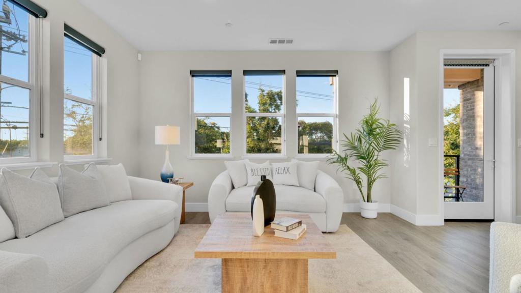 Beautifully upgraded 4B/3.5B END-UNIT townhouse in the highly desirable Nova at the Vale community! This 6 year old home features open floor plan with lots of natural light and views. The first floor has a large ground level suite with a large closet, perfect for guests or in-laws. The second floor boasts an open and bright living area with a patio off the living room with views of the mountain. Gourmet kitchen has a large island, stainless steel appliances, sleek countertops and a large pantry. The luxurious primary suite on the top floor includes a large bathroom with dual sinks. Two additional bedrooms and a full bath complete the top level. Additional highlights include hardwood floor on all 3 floors, dual-zone central AC/heating, double-pane window, attached side by side two-car garage and in-unit laundry. The well-maintained community offers low HOA fees covering water, garbage, landscaping, playgrounds and clubhouse access. Ideally located within walking distance to parks, grocery stores/restaurants, King's Academy and close to major tech companies as well as vibrant Downtown Sunnyvale, this home offers unparalleled comfort and convenience in the heart of the silicon valley.