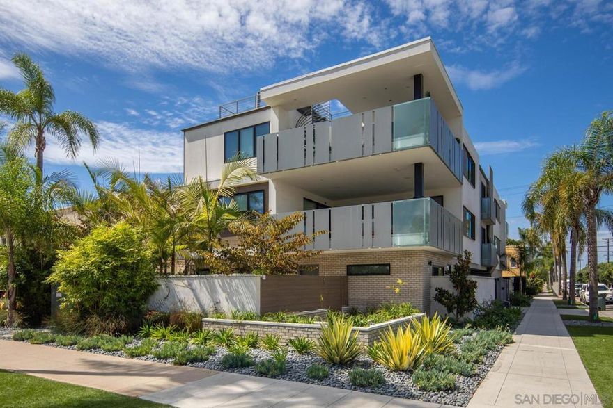 Stunning 3-bedroom top floor condo newly built in 2019 with private roof terrace to enjoy views of the San Diego skyline and the iconic Coronado Bridge. The open-concept great room has stacking slider doors to an outdoor balcony, perfect for indoor/outdoor entertaining. Gourmet kitchen includes island seating, Wolf range/oven with 6 burners, Subzero refrigerator with 2 freezer drawers, and microwave drawer. Elegant oak wood flooring flows throughout, complementing the modern design and spacious layout. Includes a two-car tandem garage and separate storage room. Elevator opens into the unit with secure private access.