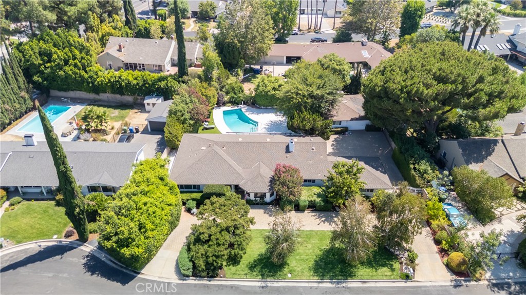 Discover this beautifully furnished 4-bedroom, 3-bath Northridge Home offering nearly 2,500 sqft of living space in a beautiful serene neighborhood. Featuring vaulted wood-beam ceilings, stone and brick fireplaces, and an open-concept floor plan, this residence blends timeless character with modern comfort. The living space is expansive with 2 living areas and lots of nooks and spaces for flex use.
The remodeled kitchen is highlighted by granite countertops and ample cabinetry, flowing seamlessly into the formal dining and spacious living areas—perfect for both relaxing and entertaining. The primary suite includes a walk-in closet and private bath, while additional bedrooms offer comfort and flexibility.
Enjoy resort-style living in the backyard with a sparkling pool and multiple patios for entertaining. The large driveway provides plenty of space for vehicles and storage.
This rental includes the main home only (guest house not included) and is offered fully furnished, ready to move in and enjoy.
