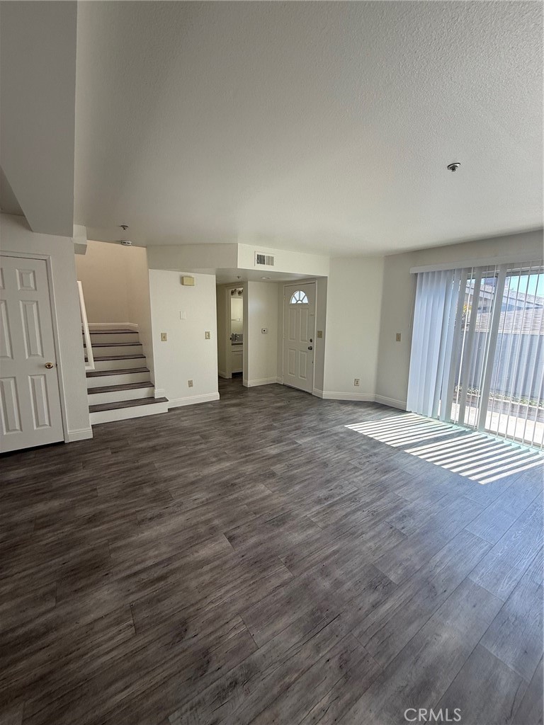 Newly remodeled 3 bedroom townhome with 2.5 bathrooms. In unit stackable washer and dryer and a private two car garage. The unit has hardwood vynal flooring throughout