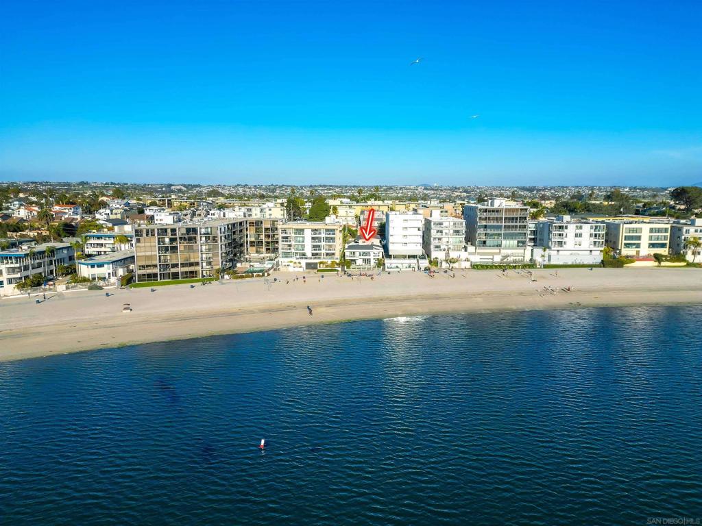 REFRESHED AND IMPROVED! Incredible once-in-a-lifetime opportunity to acquire a six-unit trophy property directly on the sand in Sail Bay. The property exudes the pride of ownership, meticulously maintained over the last 18 years. The main unit boasts water views from every main living area, tons of natural light, 4 bedrooms and 2.5 bathrooms. Plenty of entertainment space with multiple balconies, patio, grass space, 3 living rooms/ family rooms and direct sand access to enjoy water activities. This one-of-a-kind property also includes (1) 2 bed/2.5 bath and (4) 1 bed/1 bath units, currently rented below market value rents. There is potential to increase the NOI by bringing all rents to market rates. The main 4 bed/2.5 bath unit is an extremely successful vacation rental, continuously booked year-round. Additional income from the laundry machines on the property. Each unit is individually metered for electricity, with a new roof installed in 2021. This property has been self-managed for the last 18 years by the current owners, ensuring exceptional care. This rare offering presents a unique opportunity to add a highly sought-after asset to your commercial real estate portfolio. Don't miss out on this chance to acquire a well-maintained property in a prime location.
