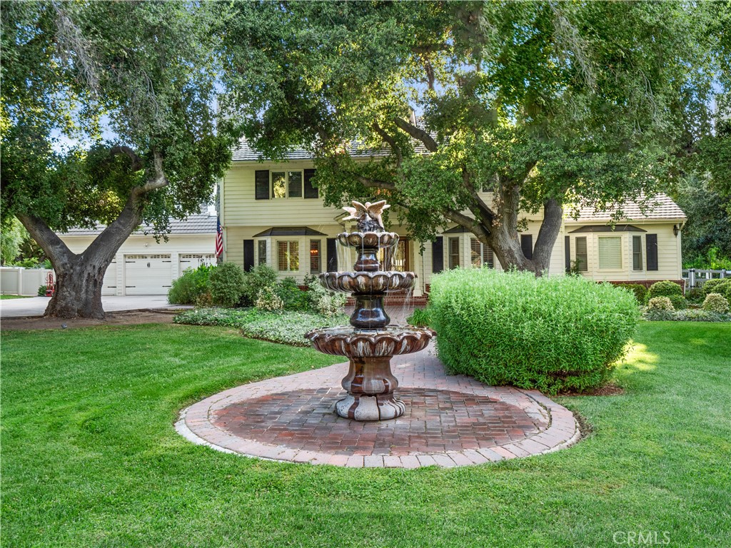 The Heart of Sand Canyon’s Crown Jewel – Macmillan Ranch! Welcome to one of the most coveted addresses in all of Santa Clarita. Tucked behind the gates of prestigious Macmillan Ranch, this rare Colonial estate offers over 4,200 square feet of elegance on more than 2 flat, usable acres of lush, manicured grounds. From the moment you arrive, you’ll see why people drive from all over LA just to experience the prestige and beauty of this iconic neighborhood. The estate boasts 5 bedrooms, 5 bathrooms, and an entertainer’s dream backyard with a Pebble Brilliance pool & spa, fully equipped outdoor kitchen (BBQ, pizza oven, fire-pit, covered patio), and towering oak trees providing unmatched serenity and shade. Inside, every detail has been elevated. The gourmet chef’s kitchen features dual islands, Sub-Zero and Viking appliances, a wine fridge, pot filler, and stunning Van Gogh granite countertops. The downstairs guest suite is ideal for multi-gen living or visitors. Upstairs, a bonus suite with private entrance offers space and privacy, while the luxurious primary suite includes vaulted ceilings, a fireplace, spa bath, and custom walk-in closet. Additional highlights: 26,000-watt whole-home generator, 3-car garage, and proximity to incredible schools, Sprouts, Vons, and the 14 freeway—all just 5 minutes away. This is more than a home—it’s a legacy estate in Santa Clarita’s most exclusive enclave. Come experience Macmillan Ranch for yourself.