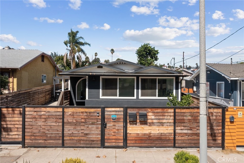 A beautifully remodeled detached duplex has just hit the market in the heart of Silver Lake, offering the perfect blend of modern style and comfortable living. Set in a friendly neighborhood, this home is surrounded by lush landscaping and features a sleek exterior design complemented by a spacious wood-and-tile deck—an ideal spot to relax and recharge.
The property includes two separate residential units plus a versatile bonus space, perfect for a home office, studio, or yoga room.
Front Unit: Bright and open with 2 large bedrooms, 2 bathrooms, and a generous living area. The kitchen features a center island and brand-new appliances.
Rear Unit: A 1-bedroom, 1-bathroom layout with its own island kitchen, new appliances, and comfortable living space. Wide sliding patio doors connect to the backyard, seamlessly blending indoor and outdoor living.
The private deck and landscaped yard create a welcoming retreat right at your doorstep.
This home combines exceptional quality, thoughtful design, and modern convenience—all within one of L.A.’s most vibrant neighborhoods. Don’t miss the opportunity to make this Silver Lake gem your own!