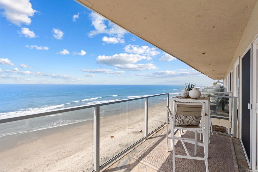 Enjoy panoramic whitewater views and true beachfront living from this top-floor corner unit. With floor-to-ceiling windows and a spacious covered deck, this condo captures the best of coastal Oceanside—sunsets, surf, and sea breezes all from the comfort of home! This light-filled residence features brand new flooring and an open living space that seamlessly connects to the expansive ocean-view deck, ideal for outdoor dining or relaxing while watching dolphins swim by. The gated, 10-unit community provides exclusive access to a pristine private beach complete with palapa shade and steps leading down to the water, as well as underground parking, secure entry, and private storage for all your beach gear. Set in a prime location, this home is walking distance to Oceanside’s growing collection of top restaurants, cafés, and shops. Stroll along the beach to the iconic Oceanside Pier, visit the historic Top Gun House, or head to the picturesque harbor and marina for paddleboarding, kayaking, and waterfront dining. Just a short drive away, Carlsbad Village offers even more to explore with boutique shopping, craft coffee houses, and a lively coastal atmosphere. Experience the best of the coastal lifestyle in one of Southern California’s most dynamic beachfront communities. Make the ocean your backyard and claim your place on the sand!