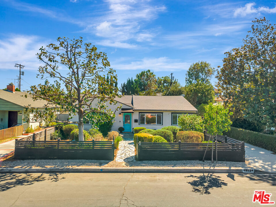 Partially furnished, stunning 4-bedroom, 2-bathroom home in the heart of Valley Village. This beautifully updated property features recessed lighting, hardwood floors, and central AC. The open-concept living and dining areas flow seamlessly into the custom kitchen, complete with a spacious pantry, stainless steel appliances, and an oversized center island. The primary suite offers vaulted ceilings, a walk-in closet, and a stylish ensuite bath. Outdoors, enjoy your private retreat with a sparkling new pool, thoughtfully designed entertaining spaces, and solar panels for energy efficiency. Located close to shopping, dining, and all that Valley Village has to offer. This home is not to be missed! Please note MAX 10 month lease.
