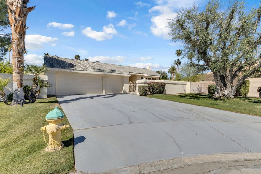 Welcome to 39 Santo Domingo Drive, a beautifully renovated 3-bedroom, 3.5-bath home with 2,563 sq ft of refined living space and a spacious 3-car garage. Tucked at the end of a quiet cul-de-sac in the exclusive gated community of Mission Wells, this home offers luxury, privacy, and endless potential.Inside, sunlight fills the expansive open-concept living area, where elegant finishes, recessed lighting, and stylish fixtures create a warm, inviting ambiance. The chef's kitchen is a showstopper, featuring granite countertops, high-end stainless steel appliances, and a built-in coffee machine--perfect for everyday enjoyment or entertaining. Each bedroom offers its own ensuite bath for ultimate comfort, while the primary suite impresses with a spa-like bathroom complete with a jacuzzi tub and steam shower.Step outside to a generous backyard ready for your dream desert retreat--there's room to build your ideal outdoor living space.