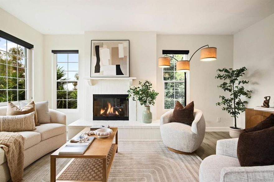 Discover the allure of this top-floor condominium in Arbor Village, where a tranquil lifestyle awaits amidst a secluded setting nestled on a tree-lined street in Hillcrest. This two-story end unit provides unparalleled privacy, sharing only one wall, and features dual primary en-suites, including one with an expansive walk-in closet. The inviting floor plan encompasses a spacious living room with a fireplace, a dining area, and a newly renovated kitchen equipped with quartz countertops, a chic backsplash, custom cabinetry, and stainless appliances. From the private balcony, indulge in the picturesque views of the neighborhood. Elegantly crafted with luxury vinyl plank flooring, this unit includes in-unit, full-size laundry and comes with two non-tandem parking spaces. Centrally located and situated within a secure gated community offering convenient access to boutique restaurants, trendy shopping, nearby freeway access, Mission Valley, Balboa Park, Downtown and Little Italy.