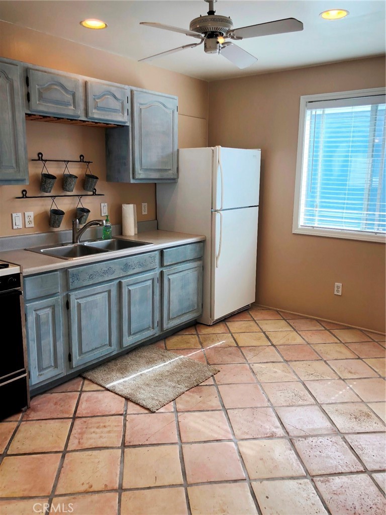 Walking distance to the beach, this unique upstairs 2 bedroom, 1 bath unit in a duplex is truly charming! As you enter into the living room, which is central to all other rooms, you will notice neutral color carpet and paint. Kitchen is located off the living room and includes Spanish tile floors, faux finished cabinets, black appliances, and a ceiling fan. Spacious sized bedrooms and generous bathroom. This unit comes with a private single car garage, as well as a very nice size storage room. Come enjoy all that Corona del Mar has to offer....restaurants, shops, the ocean, and more!