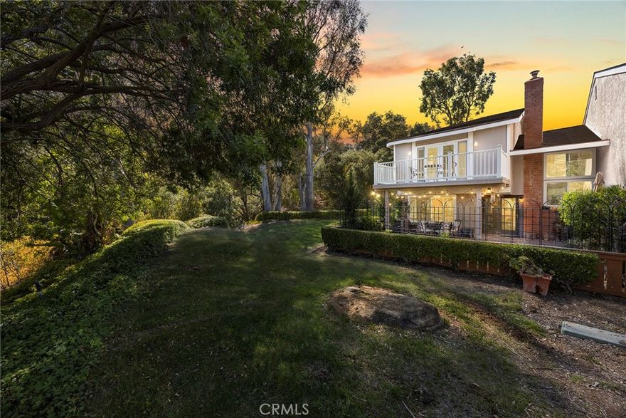 Welcome to this beautifully 1,539sqft, updated 3-bedroom, 2-bathroom residence, a true standout in the community thanks to its prime corner lot location, large yard, and sweeping canyon views. The home blends comfort with unique character, offering thoughtful upgrades inside and out.

The spacious primary suite has been fully remodeled with a soaking tub, separate walk-in shower, dual sinks, custom storage, and a skylight that brings in natural light. A private balcony extends the suite, creating a peaceful retreat. Updated stairs with a modern touch led to open living areas enhanced by industrial brick accents and warm wood ceilings. Recessed lighting throughout and a modern ceiling fan in the living room add to the inviting atmosphere.

The kitchen has been updated with stainless steel appliances, a 5-burner cooktop, wine fridge, and a versatile microwave/air fryer/oven combo. A charming garden window adds light and character, making the kitchen a central gathering point that truly draws people in. The main floor features wood flooring paired with neutral tile, while upstairs has updated carpet for added comfort.

Designed for convenience and flexibility, the layout includes a downstairs bedroom with an adjacent full, updated bathroom. The living spaces flow seamlessly into the expansive backyard, complete with a brick patio and generous lawn, ideal for gatherings or simply enjoying the views.

Additional highlights include a 2-car garage, new roof, dual-pane windows with shutters, and automatic blackout blinds in the primary suite. The community offers access to a pool, spa, and additional amenities. Conveniently located near the toll roads, 91 freeway, shopping, dining, and entertainment, with easy access to Irvine.

This property combines style, location, and practicality ready to welcome its next owner.