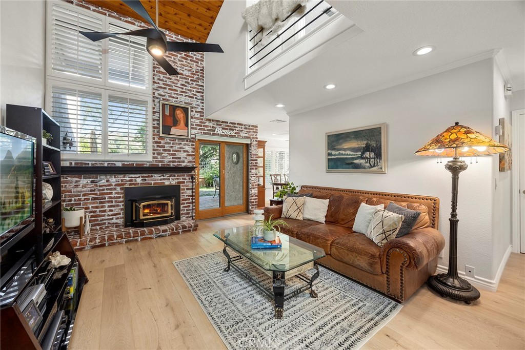 Welcome to this beautifully 1,539sqft, updated 3-bedroom, 2-bathroom residence, a true standout in the community thanks to its prime corner lot location, large yard, and sweeping canyon views. The home blends comfort with unique character, offering thoughtful upgrades inside and out.
The spacious primary suite has been fully remodeled with a soaking tub, separate walk-in shower, dual sinks, custom storage, and a skylight that brings in natural light. A private balcony extends the suite, creating a peaceful retreat. Updated stairs with a modern touch led to open living areas enhanced by industrial brick accents and warm wood ceilings. Recessed lighting throughout and a modern ceiling fan in the living room add to the inviting atmosphere.
The kitchen has been updated with stainless steel appliances, a 5-burner cooktop, wine fridge, and a versatile microwave/air fryer/oven combo. A charming garden window adds light and character, making the kitchen a central gathering point that truly draws people in. The main floor features wood flooring paired with neutral tile, while upstairs has updated carpet for added comfort.
Designed for convenience and flexibility, the layout includes a downstairs bedroom with an adjacent full, updated bathroom. The living spaces flow seamlessly into the expansive backyard, complete with a brick patio and generous lawn, ideal for gatherings or simply enjoying the views.
Additional highlights include a 2-car garage, new roof, dual-pane windows with shutters, and automatic blackout blinds in the primary suite. The community offers access to a pool, spa, and additional amenities. Conveniently located near the toll roads, 91 freeway, shopping, dining, and entertainment, with easy access to Irvine.
This property combines style, location, and practicality ready to welcome its next owner.