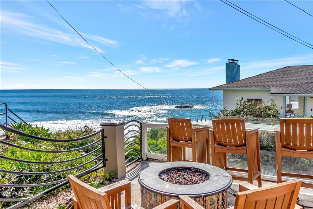 Motivated Seller! Discover an unparalleled coastal haven at Cress Street Beach. We proudly present an extraordinary opportunity to acquire a truly unique 3 Bedroom 2.5 bath single level home, that also includes a duplex with amazing ocean views, only steps to the sand. This highly coveted property features 2 homes on 1 over-sized lot, including 3 elegantly appointed ocean-view villas, 120, 130, & 150 Cress Street are set on an expansive and meticulously hardscaped lot. Perfectly suited for an exquisite owner-occupied residence, or for the most discerning real estate investor. This remarkable property allows the owner to enjoy one of the most coveted beach house locations in Southern California while boasting an impressive annual revenue of nearly $500,000 per year, or live in the primary single level home full time and continue to take advantage of the vacation rental permits and rent the duplex for $250,000-$300,000 a year! The centerpiece of this extraordinary ensemble, is of course, the primary villa, 150 Cress Street, it is a sophisticated single-level residence offering 3 spacious bedrooms and 2.5 opulent baths. This villa includes a private 1-car garage and a gated driveway accommodating up to 3 vehicles. The additional two villas, separated by only one common wall between them, feature 3 bedrooms and 2 baths, and 2 bedrooms with 1 bath respectively, they share a separate two-car garage, accessed from an entirely different street, ensuring privacy and tranquility for the primary villa. This is a once in a lifetime opportunity. Your dream of owning a piece of paradise on the world famous shores of Laguna Beach awaits.