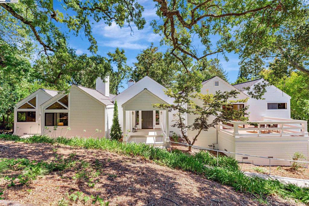Step into a spacious single-level home nestled on a peaceful cul-de-sac in the heart of Alamo. This ±3,203 sq ft home features a 2-bedroom, 2.5-bath layout (public records list it as 3 bedrooms), fresh interior paint, and a roof that is about 6 months old, ensuring peace of mind. The home features generous formal living and dining areas, vaulted ceilings, and an abundance of natural light throughout. The kitchen—while original—offers plenty of cabinet space and a functional layout, presenting an excellent opportunity for the next owner to personalize and update to their taste. Appliances are also original and in working condition. The expansive primary suite includes a large bathroom and private access to the backyard patio—ideal for relaxation and morning coffee. A secondary bedroom with its own bath is located at the opposite end of the home, providing privacy for guests or multi-generational living. Enjoy the California lifestyle with multiple outdoor seating areas, mature trees, and privacy on nearly half an acre. Additional highlights include a ±280 sq ft finished basement/flex space, a ±790 sq ft 3-car garage, and a spacious laundry/mudroom. Located minutes from Round Hill Country Club, top-rated San Ramon Valley schools, Alamo Plaza, and freeway access.