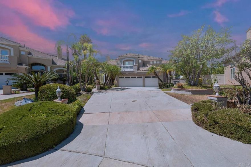 Welcome to this stunning 4,200 sq ft residence in the prestigious community. Perfectly set at the end of a private cul-de-sac with no homes behind, this property offers unmatched privacy, a long driveway, and a spacious 3-car garage.  As you enter, you’re greeted by soaring ceilings in the formal living room and elegant vinyl flooring throughout. To the left, discover a versatile piano/library room with fireplace that can serve as an optional 5th bedroom, private office, or study. The double-sided fireplace connects this space with the living room, creating both warmth and architectural charm.  The heart of the home is the chef’s kitchen, featuring quartz countertops, stainless steel cooktop, walk-in pantry, and a rare dual-island design—one in the center for prep and one flowing into the family room, perfect for entertaining.  This home offers 4 bedrooms plus the optional 5th, including two master suites. The upstairs primary retreat showcases a high ceiling, spa-like bath with dual vanities, and his-and-hers walk-in closets. On the main floor, the junior master includes a private sunroom addition—ideal as an office, rec space, or guest quarters.  Step outside to your private resort featuring a sparkling pool and spa, expansive paver patio, and a fully built outdoor entertainment area with grill, power, and space to host unforgettable gatherings.  Residents enjoy clubhouse, pool, spa, trails, and top-rated Murrieta schools. Fully renovated and move-in ready, this home combines privacy, functionality, and resort-style living.  A rare opportunity with chef’s kitchen, dual master suites, optional 5th bedroom, and an entertainer’s backyard oasis.
