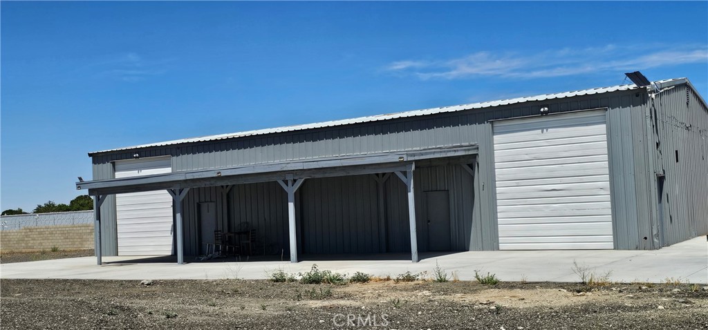 Here is your opportunity to own this light industrial property located in Lancaster, Ca. The metal building is approximately 3257 sq ft. 40'X80' building. Concrete slab around the building. You will also appreciate the covered patio off the metal building. 2 large roll-up doors and three entry doors. The property has block walls. There are three large rod iron gates to access the property. This property has it's own well. The residence on the property has been striped down to the studs. There is a new roof. The home was a 3 bedroom 2 bath home with a fireplace. A detached garage was turned into an unpermitted ADU but needs to be reverted back into a garage. Cell phone towers and their income are not included in the sale of the property.