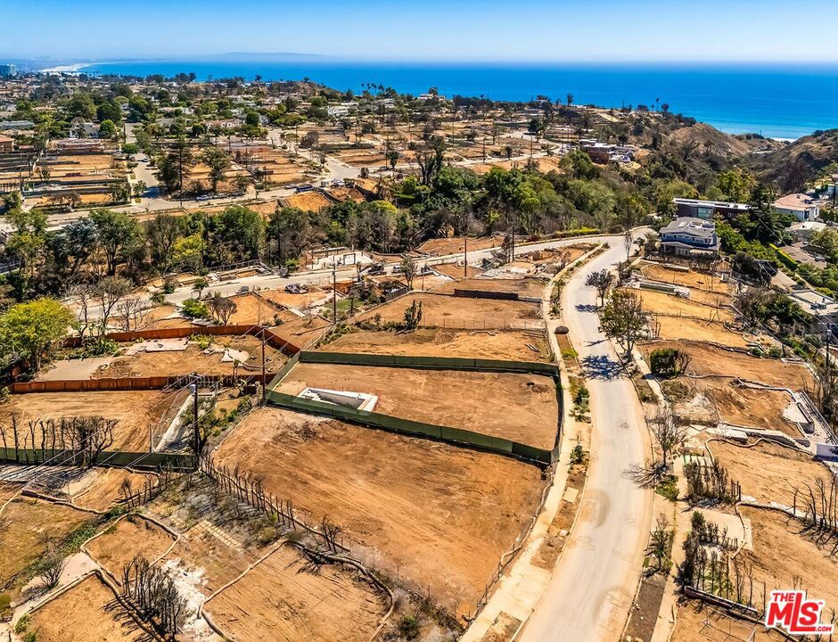 Located in a coveted neighborhood of the Pacific Palisades, this property is just moments from the beach, Palisades Village, and Marquez Elementary School. Build your dream home in an amazing location on a spacious 8,681 sqft flat lot, with potential ocean views from a second story. This property is ideally situated with convenient access to Sunset Blvd, PCH, and Temescal Canyon trails and recreation. The previous home was approximately 4,922 square feet per public records and spanned two floors. You can build up to 10% larger with a 30-day expedited permitting process per the city, buyer to verify all details. Don't miss this opportunity to be part of the re-build and have a custom home in one of LA's most sought-after communities.
