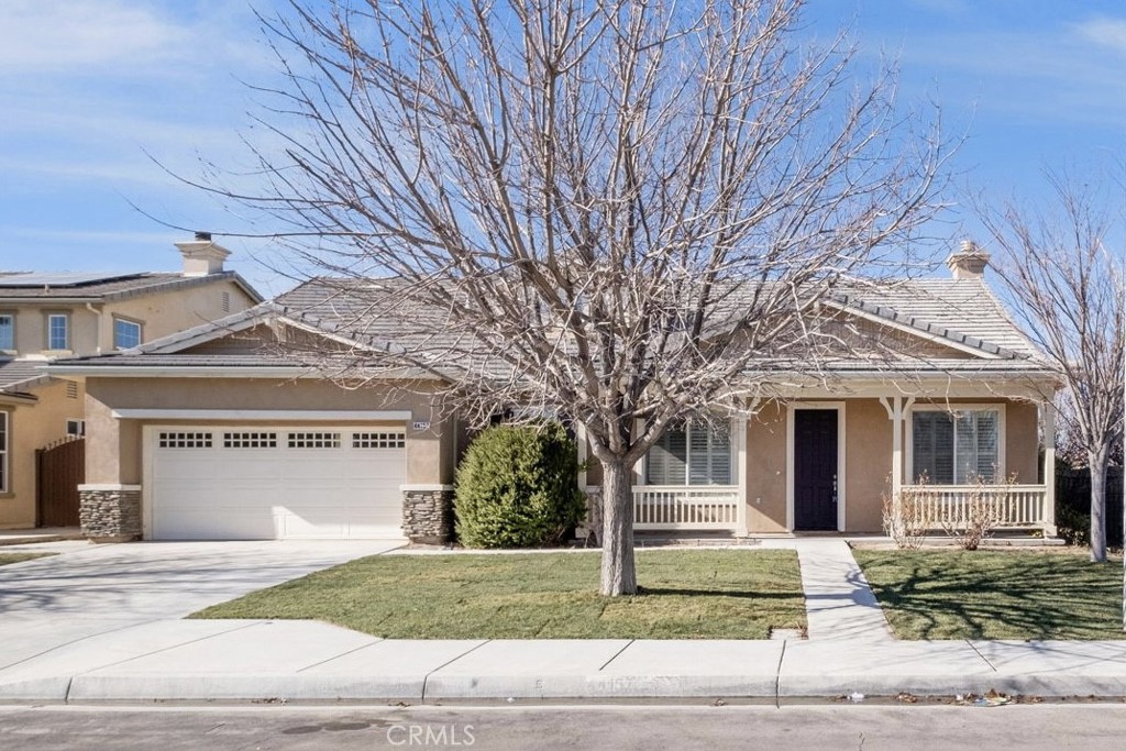 Beautiful upgraded home located in Westside Lancaster built in 2005 w/ A 3 Car Tandem Garage, Renovated Kitchen, And Fully Landscaped Park-like Backyard! Gorgeous Curb Appeal w/ A Front Porch. Custom Flooring & Baseboards, Plantation Shutters, Celling Fans Throughout That Enriches The Home. Downstairs Primary Suite That Features A Large Walk-In Closet And Backyard Access. Adjoining Formal Living & Formal Dining Rooms. The Spacious Kitchen with Quartz Counters, Double Ovens, Stainless Steel Appliances, Tile Backsplash, Extended Cabinetry, And A Large Center Island w/ Bar Stool Seating That Opens Up To The Family Room w/ A Fireplace. Upstairs Junior Suite That Showcases It's Own Massive Loft, An Office Space, A Bedroom, And A Full Bathroom! Relax In Your Fully Landscaped Backyard that offers And Extensive Covered Patio And Grass Area.
