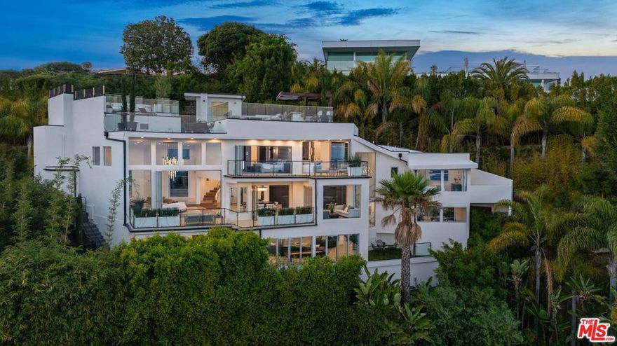 Experience unparalleled luxury and breathtaking views in this one-of-a-kind modern masterpiece. Nestled on a tranquil cul-de-sac in the coveted Bird Streets, this gated compound boasts 4 bedrooms, 5 bathrooms, and offers complete privacy and security. Upon entering, you're welcomed into a spacious open floor plan featuring soaring ceilings, perfect for entertaining while overlooking the city from DTLA to Century City and the ocean on the westside. Large glass walls open completely to showcase the stunning views and allow for seamless indoor/outdoor living and entertainment. This luxurious residence features top-of-the-line Miele appliances in the Chef's kitchen and Gessi plumbing fixtures. All custom kitchen cabinetry was imported from Italy. Italian tile throughout the house is combined with beautiful hardwood flooring and custom-made plaster walls. The upper level encompasses a sprawling Primary Suite with a private terrace overlooking city views, two large walk-in closets, a luxurious bath, and a patio with a seating area. Multiple outdoor decks, including a rooftop patio with stunning views of the ocean from Orange County all the way to Downtown Los Angeles. The property also includes a 20-foot swim/spa endless pool, fire pit, bar, and built-in BBQ, making it the perfect place to entertain. Additional features include a custom garage that can fit up to 4 cars with a lift and direct access to the home.  Ubiquiti full privacy and ADT security suite. This exceptional residence took nearly three years for a complete remodel to ensure it ranks amongst the top homes in the Bird Streets.