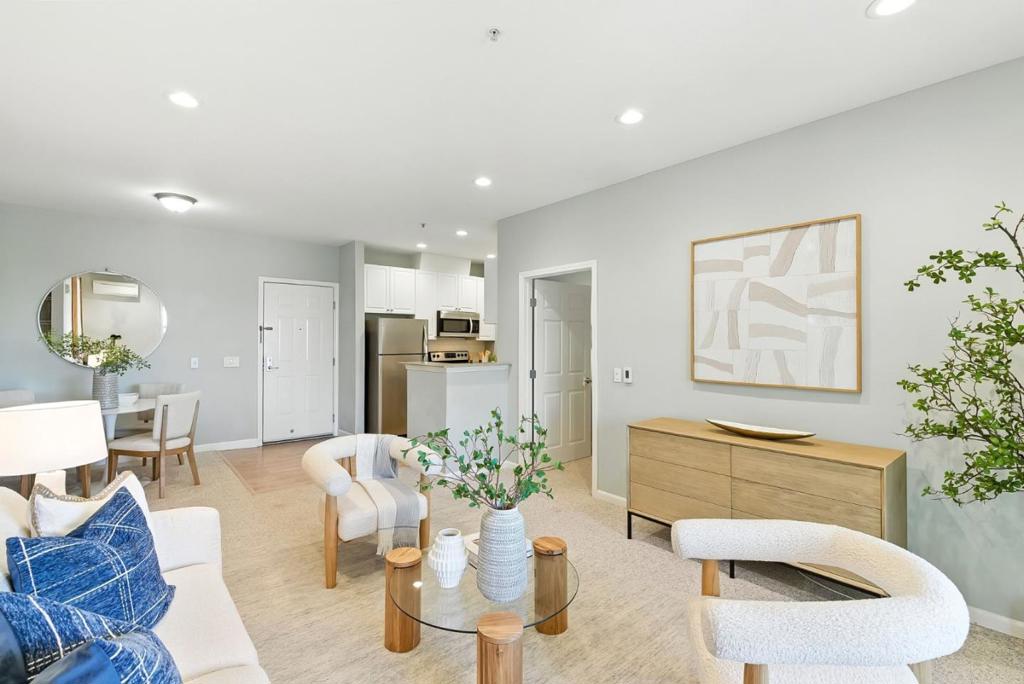 Built in 2002, this contemporary top-floor condo is located in a secured building in the heart of San Mateo. This light-filled 2 bedroom, 2 bath home offers approximately 913 square feet of thoughtfully designed living space with only one shared wall for added privacy. The open-concept layout features a spacious living and dining area that flows seamlessly into a modern kitchen complete with granite countertops, a subway tile backsplash, stainless steel appliances and white cabinetry. A private balcony just off the living room is ideal for relaxing or entertaining. The primary suite features a generous closet and en-suite bath, while the second bedroom and full bathroom offer flexible space for guests or a home office. Additional features include dual-pane windows, in-unit laundry, plantation shutters, recessed lighting, upgraded HVAC systems with A/C and heat and 2 assigned parking spaces. Norfolk Plaza offers intercom entry, elevator access, an attached gated garage and beautifully landscaped grounds. Ideally located near downtown San Mateo, major freeways and leading employers, this home offers a perfect blend of modern comfort, everyday convenience and a central location.