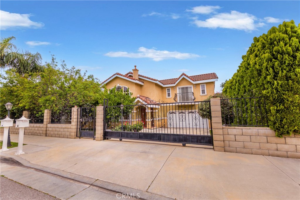 Elegant and spacious Gated House in a charming Lake Balboa neighborhood. This impressive home has an extremely functional floor plan and boasts a lovely kitchen and grand entry with soaring ceilings and grand chandler. Flow to the open space boasting a huge kitchen with granite countertops, modern backsplash, Stainless steel appliances. The open floor plan lends itself to a spacious Living and Dining area. Downstairs bedroom with full bathroom ideal for guests or home office. Master suit is located upstairs with other two other bedrooms. Washer/dryer/ refrigerator included in lease. Gardener services included. Front yard have a lot of fruit trees . Amazing 2 car garage with custom built ins for storage. EV charging available too. The house is situated on a lovely private street. Take the opportunity to make this beautiful home your own. Schedule a showing today and discover the perfect blend of comfort, convenience, and charm!