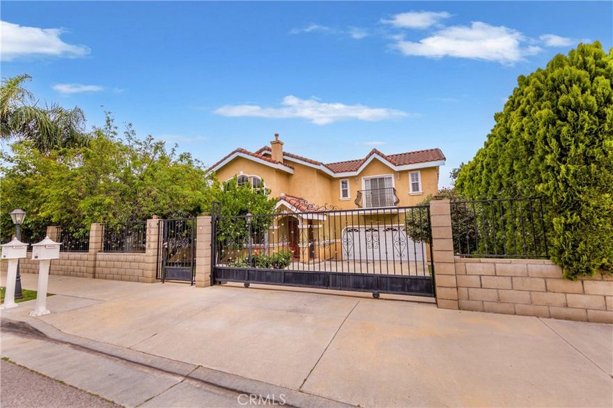 Elegant and spacious Gated House in a charming Lake Balboa neighborhood. This impressive home has an extremely functional floor plan and boasts a lovely kitchen and grand entry with soaring ceilings and grand chandler. Flow to the open space boasting a huge kitchen with granite countertops, modern backsplash, Stainless steel appliances. The open floor plan lends itself to a spacious Living and Dining area.  Downstairs bedroom with full bathroom ideal for guests or home office. Master suit is located upstairs with other two other bedrooms. Washer/dryer/ refrigerator included in lease. Gardener services included. Front yard have a lot of fruit trees . Amazing 2 car garage with custom built ins for storage. EV charging available too. The house is situated on a lovely private street. Take the opportunity to make this beautiful home your own. Schedule a showing today and discover the perfect blend of comfort, convenience, and charm!
