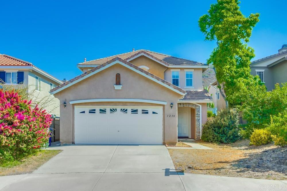This Santa Fe Hills home offers 3 spacious bedrooms and 2.5 baths, plus a bright upstairs office or homework nook. The primary suite includes a walk-in closet and a spa-inspired bath with separate tub and shower. Step outside to a backyard for entertaining, featuring a built-in BBQ area perfect for summer gatherings. Conveniently located just minutes from trails, shops, and dining, this home combines great bones with an unbeatable location.—all in a neighborhood minutes from everything you love.