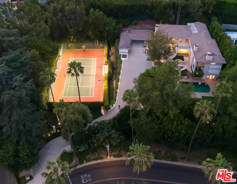 Located in the most coveted North of Sunset area in Beverly Hills, This magnificent gated property sits on over an acre of land consisting of 2 separate parcels. APN: 4350-013-016 and APN: 4350-013-017. The main residence features generous, light-filled living spaces, including an expansive family/media room with a bar, fireplace, and temperature-controlled wine room; chef's eat-in kitchen; formal dining room; staff quarters, guest quarters and an elevator with direct entry into the primary suite. French doors open to the outdoor terrace from all the upstairs bedrooms. This extremely private serene property is great for entertaining and hosting events. The sprawling grounds feature a 3-car garage, motor court, a pool with water and fire features, guest house, as well as a fully-hedged and lighted N/S tennis court.