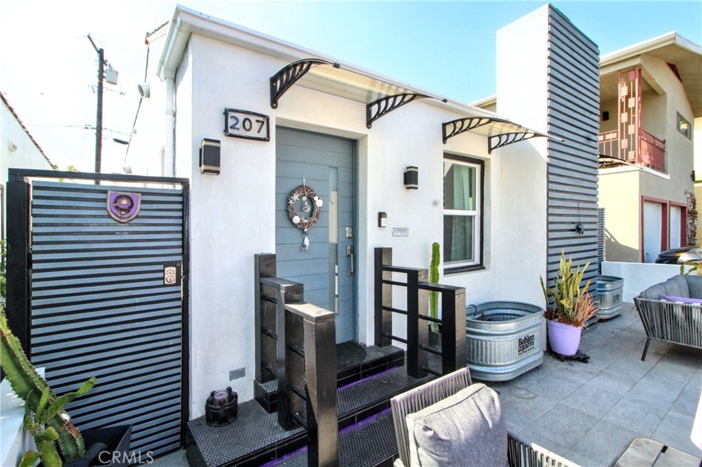 Coastal Elegance in the Heart of Belmont Shore. Experience the perfect balance of timeless charm and modern comfort in this beautifully updated 2-bedroom, 2-bath single-story home located just moments from the beach, marina, and the vibrant energy of 2nd Street in Belmont Shore. Built in 1927 and thoughtfully renovated, this 1,128 sq. ft. residence sits on a 2,252 sq. ft. lot and offers a quintessential Southern California lifestyle. Step inside to refinished original hardwood floors, a warm and inviting fireplace, and bright, airy living spaces enhanced by three skylights—one in the kitchen and one in each bathroom. The chef-inspired kitchen features a butler’s pantry, water filtration system, and abundant natural light, making it as functional as it is beautiful. The spacious primary suite provides a private retreat with a spa-like soaking tub, bidet, and generous closet space. Upgrades throughout include double-pane windows, 4 energy-efficient mini-split systems, an upgraded electrical panel, new plumbing, a tankless water heater, and a custom-built-in living room cabinet. The home also boasts a washer and dryer with a utility sink, a garage plus gated carport for vehicles, and electric gates for added privacy and security. The garage offers ADU potential, ideal for future income or expanded living space. Enjoy the outdoors with beautifully landscaped patios—perfect for morning coffee, evening entertaining, or simply soaking up the ocean breeze. Whether you’re hosting friends or enjoying quiet moments, this home delivers both comfort and style in one of Long Beach’s most desirable neighborhoods.
