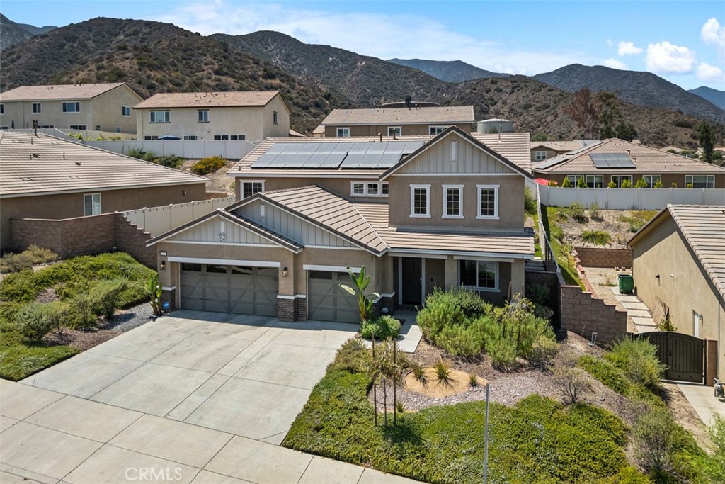 Welcome to this beautifully upgraded 2020 built home offering modern comfort and style in one of Corona’s most desirable communities Sycamore Creek. The gourmet kitchen showcases granite countertops with matching backsplash, an oversized sink, stainless steel appliances, and upgraded cabinetry. Throughout the home, you’ll find, luxury vinyl plank flooring, 5½-inch baseboards, custom remote-controlled roller shades, designer interior and exterior lighting, and smart home features including a Ring doorbell and spotlight cameras. Additional upgrades include kitchen water filtration, a tankless water heater and a Quiet-Cool whole house fan for year-round efficiency as well as a oversized solar system with 37 panels and approximately 14.3 MWh production in 2024 and 10.3 MWh in 2025 to date.
The backyard is an entertainer’s dream, featuring wrap-around concrete, low-maintenance artificial turf, custom retaining walls, slope and privacy. Both front and rear yards are beautifully landscaped for stunning curb appeal.
Perfectly situated near freeways, shopping, parks, walking trails, and restaurants, this home is part of a community that boasts the California Distinguished Award–Winning Todd Elementary School, walking distance to Deleo Sports Park. Residents also enjoy close proximity to the community clubhouse, water park, and multiple pools.