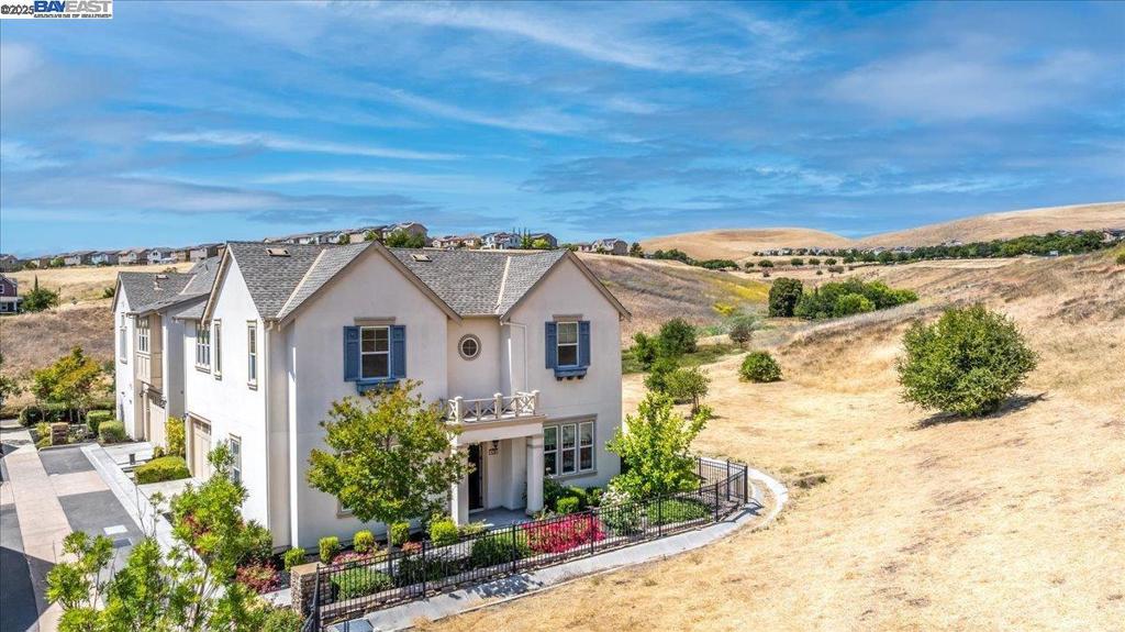Welcome to your dream home in the heart of Jordan Ranch, crafted by renowned luxury builder Toll Brothers. This exquisite residence is nestled on a one-of-a-kind premium corner lot offering unmatched privacy and tranquility. Backing to serene natural surroundings with only one adjacent home, this property enjoys nature views from every room. Designed with elegance and comfort in mind, this model-like home features $183k in extensive upgrades. Rich hardwood flooring throughout flows through the open-concept living spaces, creating a warm and inviting atmosphere. The chef’s kitchen is a culinary masterpiece, boasting a large center island, sleek modern white cabinetry, Italian marble countertops, and top-of-the-line stainless steel appliances—perfect for both everyday living and entertaining. Retreat to the secluded primary suite, where you’ll enjoy scenic views and a luxurious spa-like bath complete with dual sinks, marble countertops, and a relaxing sunken tub. Upstairs, you’ll find a convenient laundry room and spacious secondary bedrooms, providing plenty of room for family or guests. Located just minutes from top-rated schools, shopping, parks, and picturesque trails, this home combines luxury living with everyday convenience.