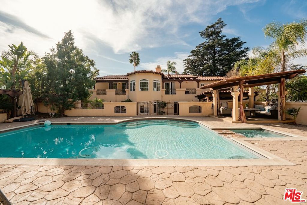 Timeless Spanish Estate: A Rare Gem in Burbank Nestled on a sprawling wide lot of over 15,000 sqft, this Spanish estate is one of Burbank's most distinguished properties, boasting an impressive 5,097 sqft of living space. Combining timeless Southern California charm with a thoughtfully designed layout for family-style entertaining, this compound is a truly rare find in the heart of Burbank. Step through the formal entryway into a sunlit Great Room, where soaring ceilings and a wood-burning fireplace create an inviting space to gather with loved ones. The formal dining room, perfect for special occasions, sets the stage for unforgettable moments shared over festive meals.The kitchen is a chef's dream, offering modern amenities, ample cabinetry, and a seamless flow into the large living room. From here, sliding doors open to the backyard, where indoor and outdoor living converge effortlessly. The sprawling grounds are designed for ultimate entertainment, featuring two distinct areas for hosting guests. Start at the grill area for an intimate gathering, then move to the expansive pool and jacuzzi area, ideal for accommodating larger celebrations. From its stunning architectural details to its versatile spaces for relaxation and entertaining, this estate exudes warmth, elegance, and functionality, making it the perfect retreat to call home. This residence is offered with brand-new furnishings included in the sale. Buyers may curate the space to their taste by retaining or removing any pieces as desired! Newly Purchased Furniture included! Seller may consider SELLER FINANCING (aka Seller-Carry) depending on terms for Buyer. DO NOT DISTURB OCCUPANTS.