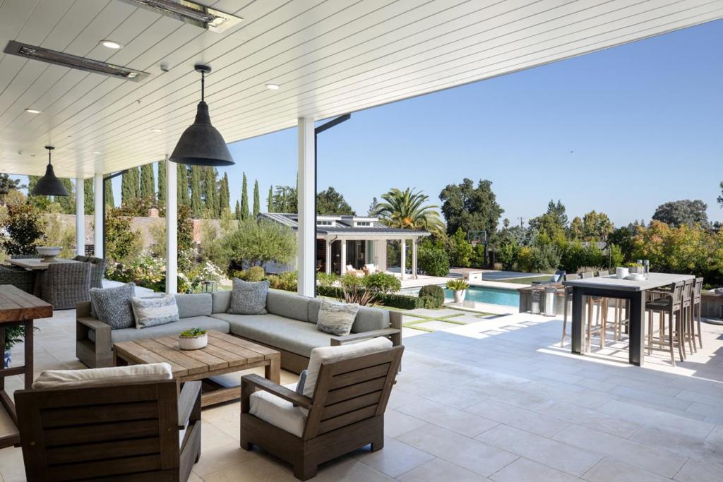 Timeless elegance can be yours in the coveted Los Altos Golf and Country Club area. Masterfully blending Hampton-esque charm with modern design, this architectural coup impresses in every way. The magic is in the marriage of classic and contemporary; glass, stone, wood and metal create an ambiance both comfortable and current. Remarkable use of space, endless amenities. This 4BR/6BA stands proudly on a beautifully manicured 28,980 sq ft lot. Two stories (3 BR up,1 down and 2 convenient half-baths on the main floor) plus library/office, bonus room, and refrigerated wine cellar. Generous open flow; white oak flooring throughout the home, bright kitchen w/massive marble island, 6-burner stove, separate pantry w/sink, utility room w/built-in cabinets and second refrigerator, plus, high-end appliances, & thoughtful extras throughout. Sliding glass doors open to a magnificent yard with pool/spa/pool house (ADU potential) encircled by mature trees and white roses. Attached 2-car garage w/ample storage, EV charger, top-of-the-line security/wifi; Sonos sound. Custom built; architect Louie Lou. Dont miss this exquisite move-in ready property; it affords estate-like living with every conceivable convenience within easy commuting distance of all the Los Altos area offers.
