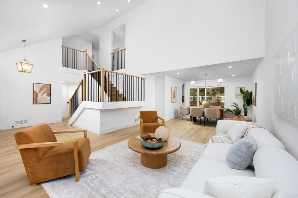 Modern Comfort Meets Resort-Style Living in Lake Mission Viejo! Welcome to your fully remodeled dream home in one of Lake Mission Viejo’s most desirable neighborhoods. Featuring 4 bedrooms, 3 stylish bathrooms, and a flexible floor plan, this home blends modern design with laid-back Southern California living. Step inside to soaring ceilings, warm wide-plank flooring, and an open staircase with sleek black accents. The living and dining spaces flow effortlessly into a designer kitchen with white shaker cabinets, quartz counters, gold toned hardware, stainless steel appliances, and a large island for casual dining and entertaining. The cozy family room offers a fireplace with wood-accent feature wall, built-ins, and sliders that lead to a lush backyard with a pergola-covered patio—perfect for relaxed evenings or weekend barbecues. Upstairs, the vaulted primary suite feels like a private retreat with a spa-like bath featuring dual vanities, gold-toned fixtures, and custom tilework. Three more bedrooms, a remodeled hall bath, and a spacious bonus room give you all the flexibility you need. As a resident of the Lake Mission Viejo Association, enjoy access to private beaches, boating, summer concerts, and community events—all just minutes from top-rated schools, parks, and shopping. This impeccably renovated home has it all—style, space, and unbeatable lifestyle perks. Come see it today!