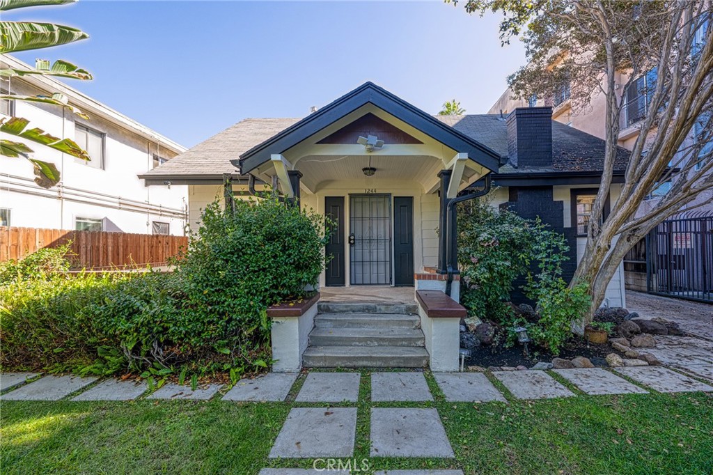 Welcome to this beautifully maintained front unit in a gated triplex, ideally located in the heart of Hollywood. Set back from major streets, this peaceful home offers a rare combination of privacy and convenience in one of L.A.'s most sought-after neighborhoods. You’ll feel like you're living in your own private home as you enjoy the spacious front yard, surrounded by lush greenery — perfect for relaxing or entertaining guests. The unit offers: A well-maintained kitchen with granite countertops, Two updated bathrooms, Central A/C for year-round comfort, In-unit laundry, Access to six parking spaces (shared among the units). The property has been impeccably cared for, both inside and out, ensuring a clean, comfortable, and move-in ready living environment. Conveniently located near Hollywood’s top shopping, dining, and entertainment options.