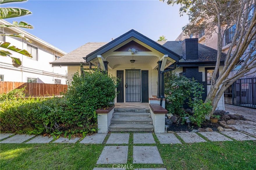 Welcome to this beautifully maintained front unit in a gated triplex, ideally located in the heart of Hollywood. Set back from major streets, this peaceful home offers a rare combination of privacy and convenience in one of L.A.'s most sought-after neighborhoods. You’ll feel like you're living in your own private home as you enjoy the spacious front yard, surrounded by lush greenery — perfect for relaxing or entertaining guests. The unit offers: A well-maintained kitchen with granite countertops, Two updated bathrooms, Central A/C for year-round comfort, In-unit laundry, Access to six parking spaces (shared among the units). The property has been impeccably cared for, both inside and out, ensuring a clean, comfortable, and move-in ready living environment. Conveniently located near Hollywood’s top shopping, dining, and entertainment options.