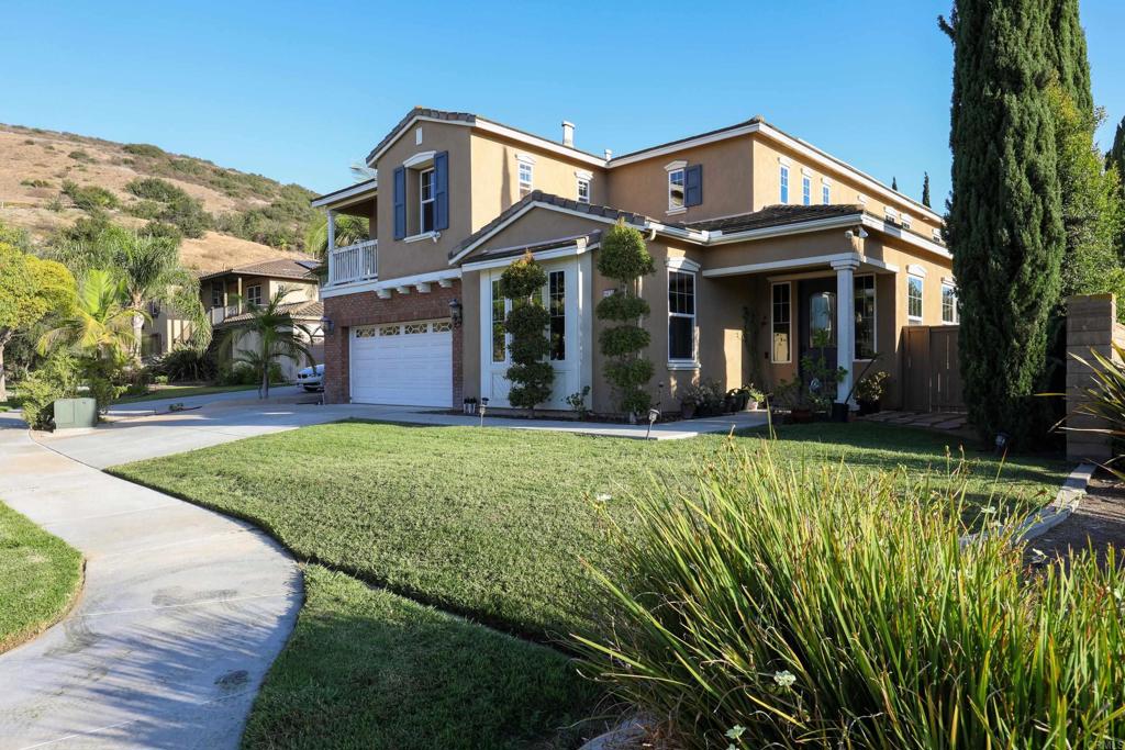 Stunning Home in San Miguel Ranch on a Cul-de-Sac! This beautifully upgraded 5-bedroom, 4.5-bathroom home is a true standout, nestled on a spacious corner lot in a quiet cul-de-sac. From the moment you walk in, you'll appreciate the elegant ambiance and thoughtful design throughout. The main level features a formal living room with a cozy fireplace, a formal dining room, and a spacious great room that seamlessly combines the kitchen, dinette, and family room—perfect for entertaining. The upgraded kitchen boasts granite countertops, stainless steel appliances, and rich wood cabinetry. Wood flooring, travertine tile, and plantation shutters add to the upscale charm. The large, landscaped backyard (11,263 sq ft lot) offers plenty of space for a swimming pool, garden, or additional outdoor living areas. The family and dining rooms open to this beautiful yard, enhancing the indoor-outdoor flow. A full bedroom and bathroom are conveniently located on the first floor, along with a unique bonus space off the garage that makes an ideal office or workspace. There’s even room to build out a storage area or maid’s quarters. The two-car garage has been thoughtfully converted into a sleek exercise studio, complete with a mirrored wall—easily converted back to a garage if desired. Upstairs, you'll find a spacious loft with elegant wrought iron railings—perfect for a home theater, second family room, or multiple office setups. The oversized primary suite includes a private balcony with views, a luxurious bathroom with a separate soaking tub and shower, and a large walk-in closet. With beautiful curb appeal, flexible living spaces, and exceptional indoor-outdoor potential, this home is truly a winner! Did I mention PAID solar system, charging station
