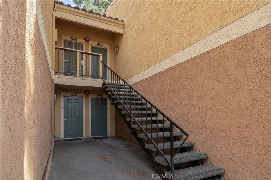 Welcome to this freshly painted first-floor condo located in the desirable Borgata community of Rancho Cucamonga! Perfectly situated just off the 210 freeway, this home is within walking distance to shopping, dining, and Trader Joe’s, making it as convenient as it is comfortable.
Step inside to a spacious living room with a cozy fireplace and sliding glass doors that open to a roomy private patio with low-maintenance artificial turf—ideal for relaxing or entertaining. The kitchen and dining area are generously sized and feature stainless steel appliances, with a refrigerator included. A dedicated laundry area with washer and dryer adds everyday convenience.
Both bedrooms are impressively large, with the primary suite offering a private bathroom. A second full bathroom in the hallway serves the second bedroom and guests with ease. The patio also includes a locked storage area for extra space.
Borgata is a gated community known for its beautifully maintained green spaces, swimming pools, and tennis courts which provides a resort-like lifestyle right at home.