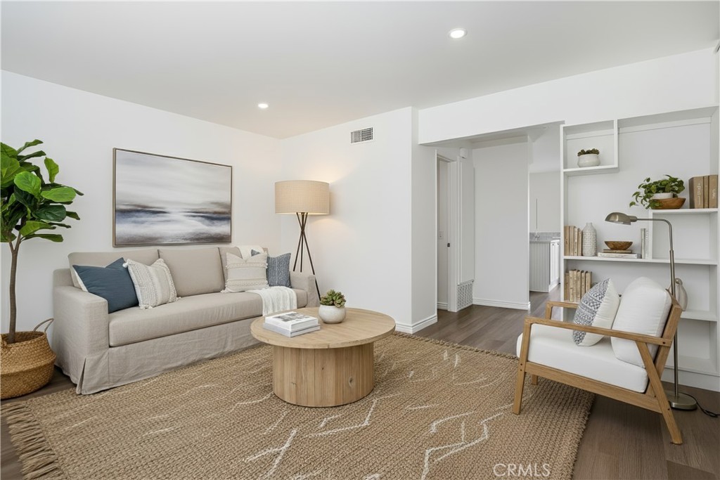 Three bedrooms? Check. Near the beach? Check. Already remodeled and updated? Check. Air-Conditioning? CHECK. CHECK. CHECK. Whatever you do, don’t miss this rare opportunity to own one of the largest 3-bedroom floorplans in Huntington Townhomes! Enjoy all the perks of living close to the beach for a sensible price, and it’s one of only a few units in the entire community to have CENTRAL AIR CONDITIONING! Nearly every surface of this beautiful, bright, beach retreat was recently touched and updated. Refreshed bathrooms, luxury quartz countertops in the kitchen, new light fixtures, and double pane windows throughout. Central Air and new furnace installed in 2021. Water heater replaced in 2018. All kitchen appliances as well as washer & dryer included. With plenty of guest parking for your friends, the community boasts fantastic amenities including a playground, pool, communal spa and is VA/FHA APPROVED! Located within walking distance of Huntington Harbor, parks, the beach and grocery stores, this home offers easy access to the vibrant local scene. Whether you're looking to soak up the sun at the beach or take a leisurely stroll through the neighborhood, this location provides the perfect blend of relaxation and excitement. Don't miss out on the opportunity to make this delightful home yours!