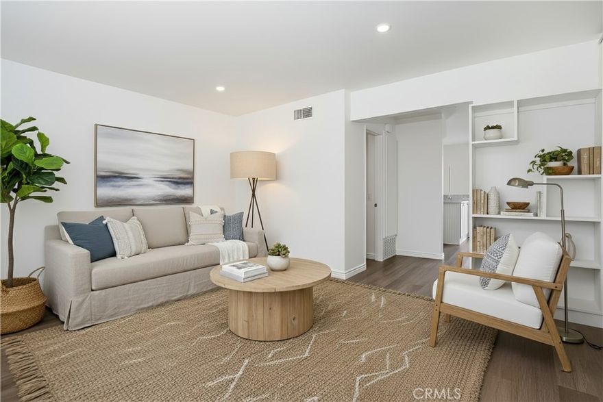 Three bedrooms? Check.  Near the beach? Check.  Already remodeled and updated? Check. Air-Conditioning? CHECK. CHECK. CHECK.  Whatever you do, don’t miss this rare opportunity to own one of the largest 3-bedroom floorplans in Huntington Townhomes! Enjoy all the perks of living close to the beach for a sensible price, and it’s one of only a few units in the entire community to have CENTRAL AIR CONDITIONING! Nearly every surface of this beautiful, bright, beach retreat was recently touched and updated. Refreshed bathrooms, luxury quartz countertops in the kitchen, new light fixtures, and double pane windows throughout. Central Air and new furnace installed in 2021. Water heater replaced in 2018. All kitchen appliances as well as washer & dryer included. With plenty of guest parking for your friends, the community boasts fantastic amenities including a playground, pool, communal spa and is VA/FHA APPROVED!  Located within walking distance of Huntington Harbor, parks, the beach and grocery stores, this home offers easy access to the vibrant local scene. Whether you're looking to soak up the sun at the beach or take a leisurely stroll through the neighborhood, this location provides the perfect blend of relaxation and excitement.  Don't miss out on the opportunity to make this delightful home yours!
