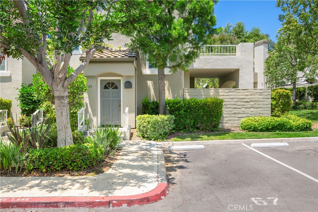 Experience the best of Aliso Viejo living in this beautifully upgraded condo in the highly desirable community of The Villas. Just a 15 min. drive to Laguna Beach, this light-filled home features 2 bedrooms, 2 bathrooms, and a spacious loft across approximately 1,375 sq ft of open living space. Vaulted ceilings and newer dual-pane windows create an airy atmosphere, complemented by custom plantation shutters and a dramatic floating staircase. The versatile loft can easily be converted into a third bedroom or used as a generous home office or media space. The living room, warmed by a cozy fireplace, flows seamlessly into the dining area and designer kitchen. The kitchen is a showstopper, featuring soapstone countertops, newer shaker cabinetry, and high-end stainless steel appliances—including a GE Café range, Bosch dishwasher, and stainless steel vent hood. Additional upgrades include a 2024 hot water heater, newer HVAC system, PEX piping, and modern ceiling fans in every room. Both bathrooms are tastefully updated with granite countertops, and the primary suite’s en-suite bath showcases sleek glass and tile finishes. Enjoy scenic neighborhood views from your private balcony, perfect for morning coffee or evening relaxation. The attached two-car garage offers added lighting, storage cabinetry, and a quiet, updated garage door. Residents of The Villas enjoy access to a resort-style pool and spa and benefit from a prime location near award-winning schools, Aliso Viejo Town Center, the 73 Toll Road, scenic parks, hiking trails, and the Aliso & Wood Canyons Wilderness Park. This home offers a rare blend of comfort, style, and convenience—schedule a tour today and see what makes this condo truly special. Property is also listed FOR SALE $899,000.