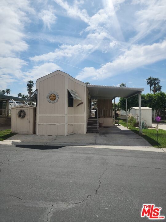 This 1990 Sunrise sets on a wide, quiet greenbelt, with a gazebo. There are many upgrades throughout the unit, a must see. The wrap around patio presents a tranquil setting over the greenebelt, ready to enjoy the beautiful desert sunsets. It is close to one of the satellites, for enjoying one of the 6 pools in the community. This all located in a 55+ community that has a 3 par golf course, chipping green, putting green, 9 hole mini golf, pickleball and tennis courts, bocce ball, an indoor shuffleboard courts, 2 clubhouses with pools and jacuzzies and an additional 4 satellites with pool, jacuzzies and mail boxes. This is all within a 24 hour gate guarded community of 801 lots, that consist of a combination of Park Models and RV lots, where you own the land. The resort has a limit of 270 day occupancy. It is a perfect place to spend your holidays in the sunshine.