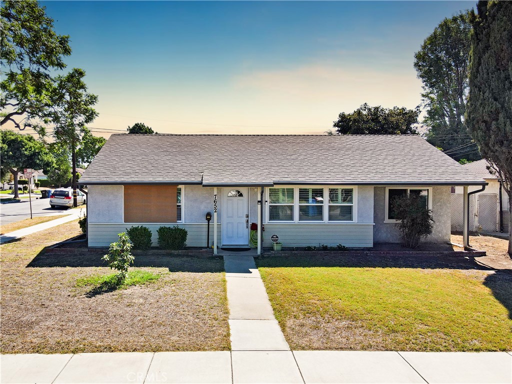 Discover the potential of this exceptional corner-lot property, featuring a spacious double-wide driveway and an oversized detached garage. With three spacious bedrooms and a thoughtfully designed bathroom, this home is perfect for comfortable living. Surrounded by mature trees, expansive wraparound lawns, and beautifully maintained gardens, you will find the ideal backdrop for outdoor entertaining and leisure activities. Inside, the home boasts a welcoming, open-concept layout that connects a generous living room to the bright kitchen and dining area—perfect for gatherings and family moments. Located just five minutes from top-notch schools, the prestigious Los Amigos Country Club, and all the vibrant amenities that Downey has to offer, this property perfectly combines accessibility with a serene lifestyle. Don't miss out on making this gem your own!