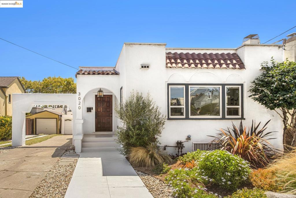 Blending timeless charm with modern sophistication, this fully renovated Spanish-Contemporary bungalow showcases high-end designer finishes, central AC, EV charger and thoughtful upgrades throughout. At the heart of the home is a show-stopping eat-in kitchen featuring chef-grade stainless steel appliances, including a state-of-the-art range and convection oven, ample cabinetry and expansive counter space. Don't miss the stylish coffee/wine bar complete with a wine fridge, sink, and open shelving. This kitchen is ideal for both everyday living and entertaining.The main level offers a bright, open-concept layout where the kitchen flows seamlessly into the dining area. In the comfortable living room, a beautifully tiled fireplace serves as a stunning focal point, while large windows flood the space with natural light.The spacious, sun-drenched primary bedroom includes a walk-in closet and a sleek, modern ensuite bath. A second generously sized bedroom and a large updated hallway bath are located just off the dining area.Downstairs, the finished lower level offers exceptional flexibility—perfect as a guest suite, home office, or income-generating rental with a bathroom and its own private entrance.Outdoors, enjoy a yard ideal for entertaining or relaxing.